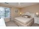 Comfortable bedroom with a large bed, neutral colors, and plenty of light at 141 Hartland Dr. # 5-C, Myrtle Beach, SC 29572