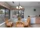 Dining area with wicker chairs and natural light streaming through window at 141 Hartland Dr. # 5-C, Myrtle Beach, SC 29572