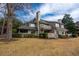 Lovely two-story home with a stone chimney, a nice porch and lots of green space at 141 Hartland Dr. # 5-C, Myrtle Beach, SC 29572