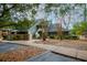 Inviting building with covered stairway and walkway, lush bushes and mature landscaping at 141 Hartland Dr. # 5-C, Myrtle Beach, SC 29572