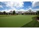 Spacious home exterior showcasing a lush green lawn, manicured landscaping, and inviting architecture at 141 Hartland Dr. # 5-C, Myrtle Beach, SC 29572