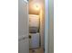 Image of a stacked washer and dryer set, inside of a laundry closet with white louvered door at 141 Hartland Dr. # 5-C, Myrtle Beach, SC 29572