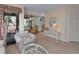 Open-concept living area with dining space, chair, glass table, and access to a patio at 141 Hartland Dr. # 5-C, Myrtle Beach, SC 29572