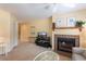Living room with a fireplace, carpet, and a television on a stand at 141 Hartland Dr. # 5-C, Myrtle Beach, SC 29572