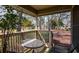 Relaxing covered patio with seating and views of the lush landscaping and distant lake at 141 Hartland Dr. # 5-C, Myrtle Beach, SC 29572