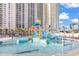 A great pool with a water slide and a high rise building in the background at 141 Hartland Dr. # 5-C, Myrtle Beach, SC 29572