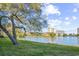 A tranquil water view from a grassy area with high rise buildings in the distance at 141 Hartland Dr. # 5-C, Myrtle Beach, SC 29572