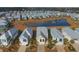 An aerial view of the neighborhood with a large pond and fountain behind the colorful homes at 148 Splendor Circle, Murrells Inlet, SC 29576