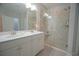 Modern bathroom with double vanity, white cabinets, quartz countertops, and a spacious glass-enclosed shower at 148 Splendor Circle, Murrells Inlet, SC 29576