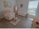Bedroom with chair and ottoman, complemented by a neutral color scheme at 148 Splendor Circle, Murrells Inlet, SC 29576