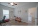 Cozy bedroom with a comfortable armchair and an adjacent ensuite bathroom at 148 Splendor Circle, Murrells Inlet, SC 29576