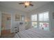 Well-lit bedroom with a ceiling fan and a view of the outdoor seating area at 148 Splendor Circle, Murrells Inlet, SC 29576