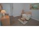 Bedroom with chair and ottoman, complemented by a neutral color scheme at 148 Splendor Circle, Murrells Inlet, SC 29576