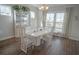 Elegant dining room featuring a modern table, stylish chairs, and natural light from the windows at 148 Splendor Circle, Murrells Inlet, SC 29576
