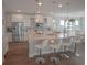 Modern kitchen featuring an island with seating, stainless steel appliances, and white cabinetry at 148 Splendor Circle, Murrells Inlet, SC 29576