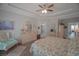 Serene main bedroom with tray ceiling, floral bedding, and decorative furniture offering a peaceful retreat at 148 Splendor Circle, Murrells Inlet, SC 29576
