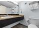 Bathroom featuring a granite sink counter with a large mirror at 1501 S Ocean Blvd. # 706, Myrtle Beach, SC 29577
