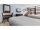 Well lit bedroom featuring two beds, desk, and a balcony at 1501 S Ocean Blvd. # 706, Myrtle Beach, SC 29577