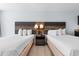 Bright bedroom featuring two beds and a center nightstand at 1501 S Ocean Blvd. # 706, Myrtle Beach, SC 29577