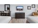 Well lit bedroom featuring two beds, desk, and entertainment center at 1501 S Ocean Blvd. # 706, Myrtle Beach, SC 29577