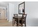 Dining area with seating for two underneath a square mirror at 1501 S Ocean Blvd. # 706, Myrtle Beach, SC 29577