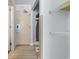 Hallway with hotel doors, a closet, and an ironing board at 1501 S Ocean Blvd. # 706, Myrtle Beach, SC 29577