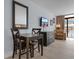 Living space features a dining table, dresser and comfortable accent chair with a tv at 1501 S Ocean Blvd. # 706, Myrtle Beach, SC 29577