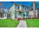 Charming two-story home with a well-manicured lawn and inviting entrance at 1551 Victoria Ln., Myrtle Beach, SC 29577