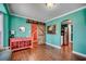 Stylish living room with hardwood floors, barn door access, and colorful decor at 1551 Victoria Ln., Myrtle Beach, SC 29577