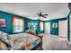 Comfortable bedroom features a large bed, colorful bedding, and ample closet space at 1551 Victoria Ln., Myrtle Beach, SC 29577