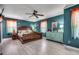 Spacious bedroom with wood furniture, ample lighting, and coastal-themed decor at 1551 Victoria Ln., Myrtle Beach, SC 29577