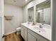 Bathroom showcases a double sink vanity and chrome fixtures, complemented by luxury vinyl plank flooring at 157 B Villa Grande St. # B, Myrtle Beach, SC 29579