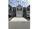 Charming townhomes feature neutral siding, black shutters, and driveways for easy parking at 157 B Villa Grande St. # B, Myrtle Beach, SC 29579