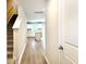 Inviting hallway with modern floors leads to a bright and spacious kitchen at 157 B Villa Grande St. # B, Myrtle Beach, SC 29579