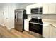 Contemporary kitchen with stainless steel appliances and ample counter space at 157 B Villa Grande St. # B, Myrtle Beach, SC 29579