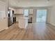 Modern kitchen features an island, stainless appliances, and sliding glass doors at 157 B Villa Grande St. # B, Myrtle Beach, SC 29579
