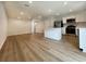 Bright, open-concept kitchen and living area with modern flooring and recessed lighting at 157 B Villa Grande St. # B, Myrtle Beach, SC 29579