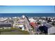 Aerial view of beach homes, businesses, and the ocean pier on a clear day at 166 Hoffman Park Dr. # 16, Myrtle Beach, SC 29588
