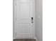 A modern white front door with stylish hardware accents the interior at 166 Hoffman Park Dr. # 16, Myrtle Beach, SC 29588