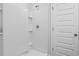 Clean white shower with built-in shelving and modern fixtures in bathroom at 166 Hoffman Park Dr. # 16, Myrtle Beach, SC 29588