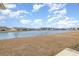 Beautiful backyard with a serene lake view surrounded by well-maintained lawns and neighboring homes at 1881 Moonseed Dr., Longs, SC 29568