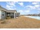 This backyard boasts a screened porch and leads to a serene pond, perfect for relaxation at 1881 Moonseed Dr., Longs, SC 29568