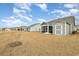 Expansive backyard showing neighboring homes and a shed, creating a private outdoor space at 1881 Moonseed Dr., Longs, SC 29568