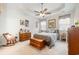 Serene main bedroom with a comfortable bed, wooden dresser, and a relaxing atmosphere enhanced by natural light at 1881 Moonseed Dr., Longs, SC 29568