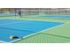 A vibrant pickleball court with clear lines and a well-maintained surface, ready for a game at 1881 Moonseed Dr., Longs, SC 29568