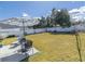 Spacious backyard featuring a plush lawn, manicured landscaping, and a lovely patio set for outdoor enjoyment at 217 Sienna Dr., Little River, SC 29566