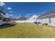 Expansive backyard with well-maintained lawn, patio, and white fence, offering ample space for outdoor activities and privacy at 217 Sienna Dr., Little River, SC 29566