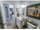 Well-maintained bathroom with a white vanity, modern faucet, and decorative accents at 217 Sienna Dr., Little River, SC 29566