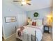 Comfortable bedroom with plush carpet, a ceiling fan, and ample natural light at 217 Sienna Dr., Little River, SC 29566