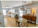 Charming dining area featuring an antique buffet and an open view of the kitchen at 217 Sienna Dr., Little River, SC 29566